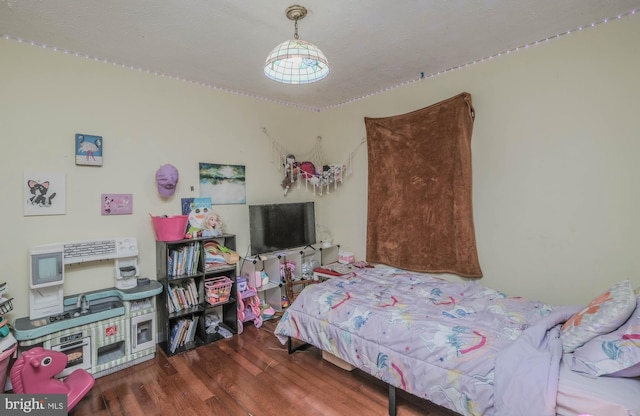 bedroom featuring dark hardwood / wood-style floors