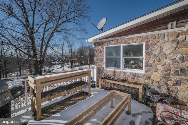 view of snow covered deck