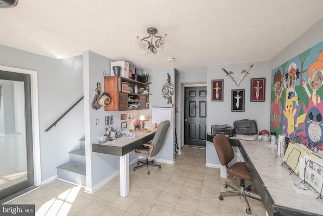 home office featuring a textured ceiling