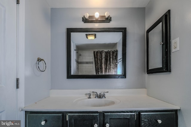 bathroom with vanity and curtained shower