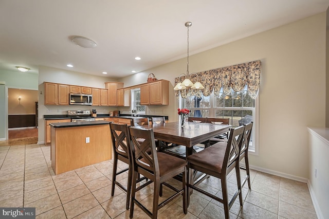 dining area with light tile patterned floors, baseboards, a chandelier, and recessed lighting