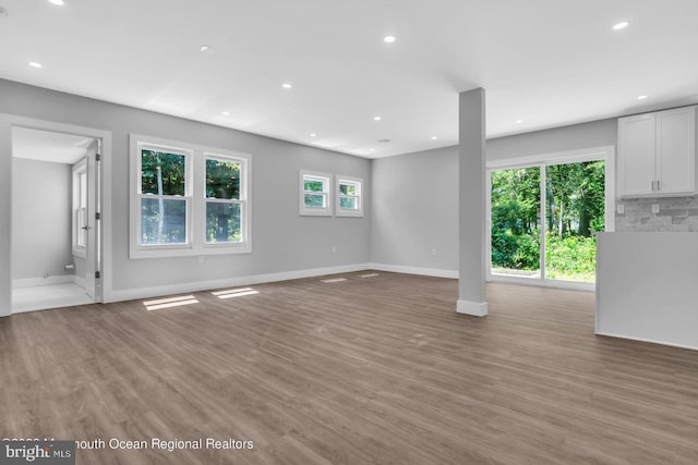 unfurnished living room with light hardwood / wood-style floors