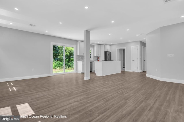 unfurnished living room with hardwood / wood-style flooring