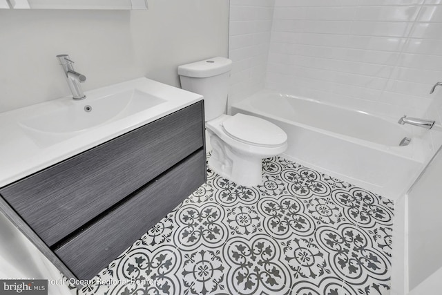 full bathroom featuring toilet, shower / washtub combination, vanity, and tile patterned floors