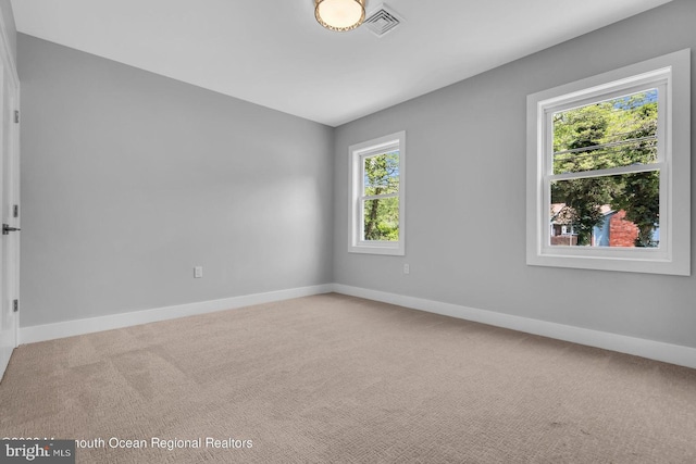 empty room with carpet flooring