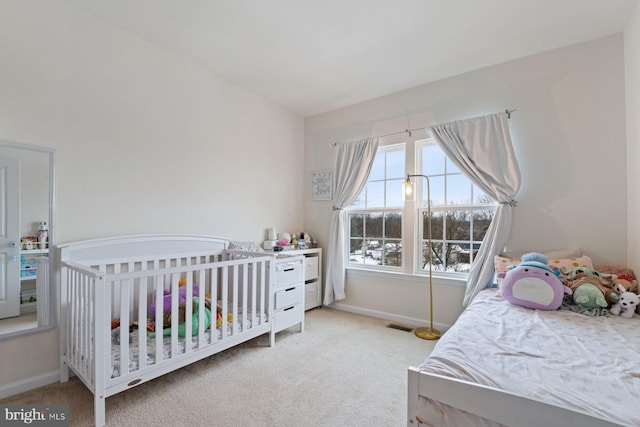 bedroom featuring light colored carpet