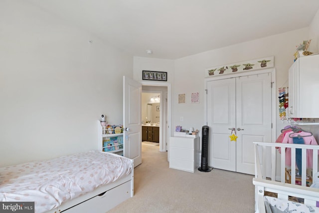 bedroom with light colored carpet and a closet