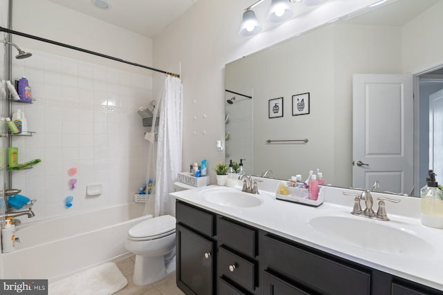 full bathroom featuring shower / bath combo with shower curtain, toilet, vanity, and tile patterned flooring