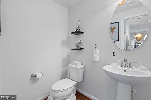 bathroom with sink and toilet