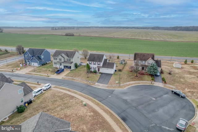 birds eye view of property featuring a rural view