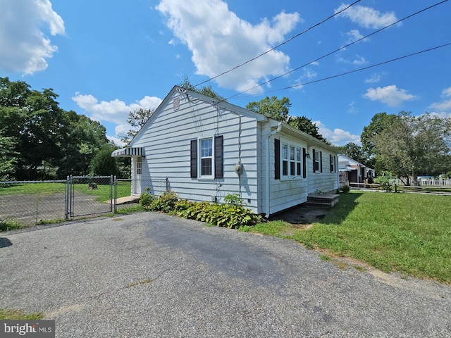 view of home's exterior featuring a lawn