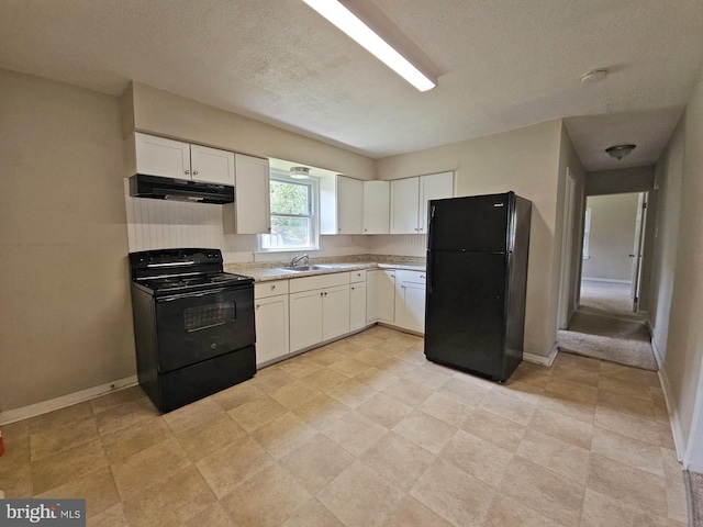 kitchen featuring sink, a textured ceiling, white cabinetry, and black appliances