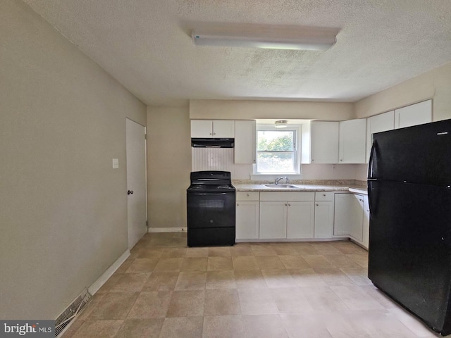 kitchen with sink, white cabinets, a textured ceiling, and black appliances