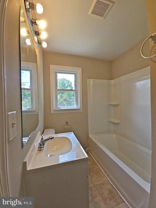 bathroom with shower / tub combination and vanity