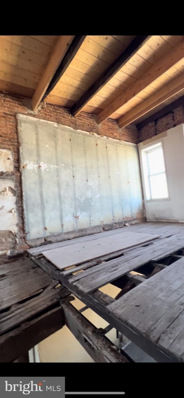 miscellaneous room featuring wooden ceiling and beamed ceiling