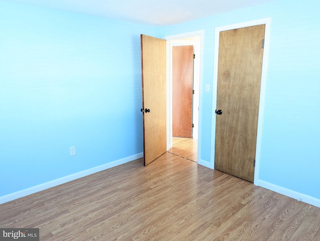 unfurnished bedroom featuring light hardwood / wood-style floors