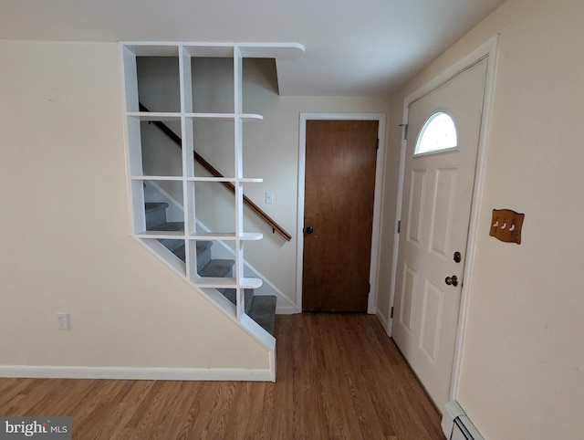 entryway with hardwood / wood-style floors