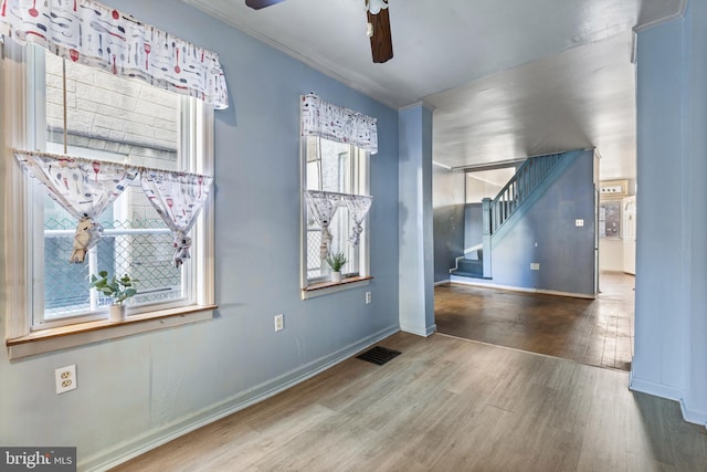 spare room featuring ceiling fan and hardwood / wood-style floors