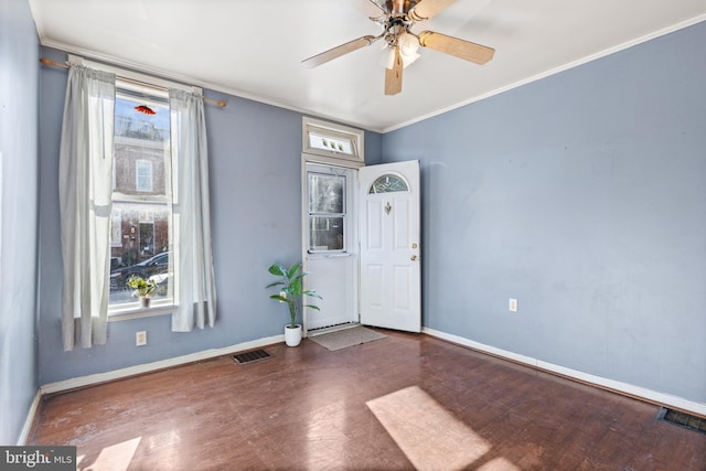 entrance foyer with ceiling fan, ornamental molding, and hardwood / wood-style flooring