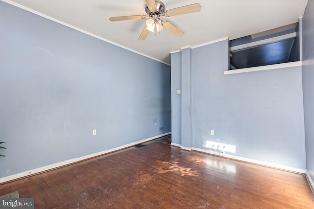 spare room featuring ceiling fan, crown molding, and dark hardwood / wood-style flooring