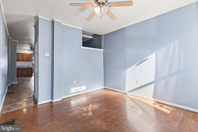 spare room with ceiling fan and dark hardwood / wood-style floors