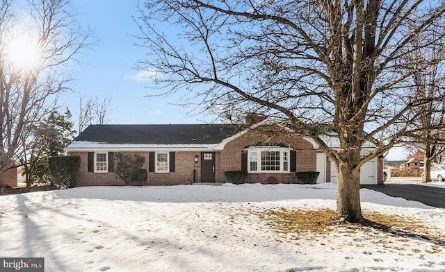 ranch-style house featuring a garage