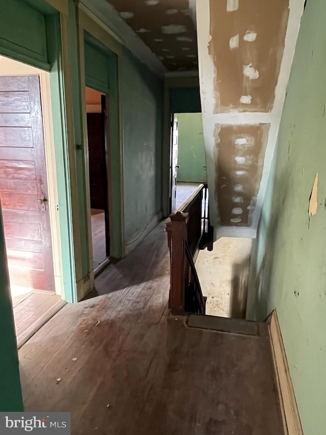 corridor with wood-type flooring