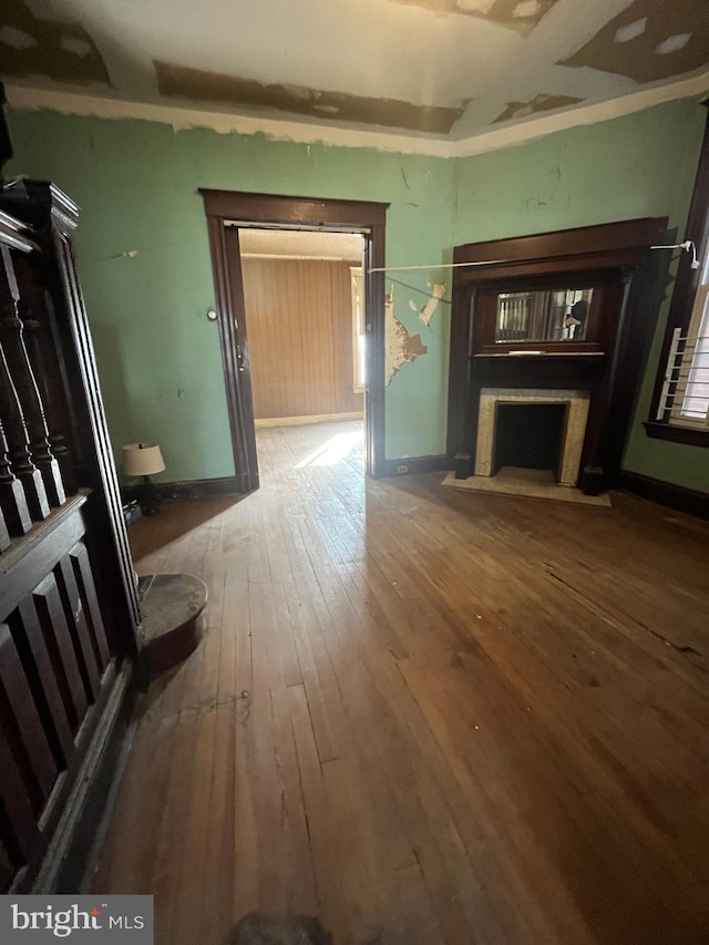 unfurnished living room with hardwood / wood-style floors