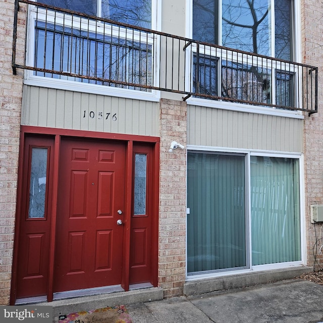 entrance to property with a balcony