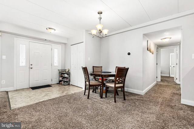 carpeted dining space with an inviting chandelier