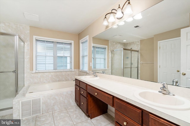 bathroom featuring vanity, independent shower and bath, and tile patterned flooring