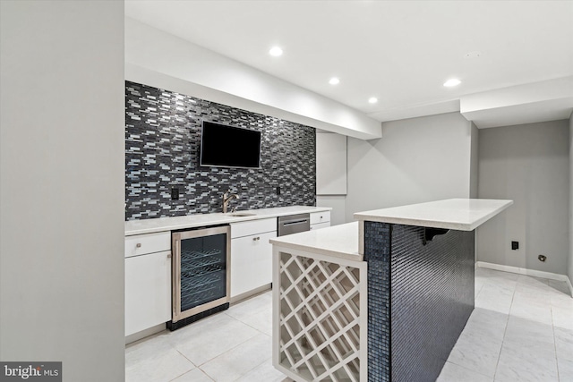 kitchen with dishwasher, a center island, white cabinetry, tasteful backsplash, and wine cooler