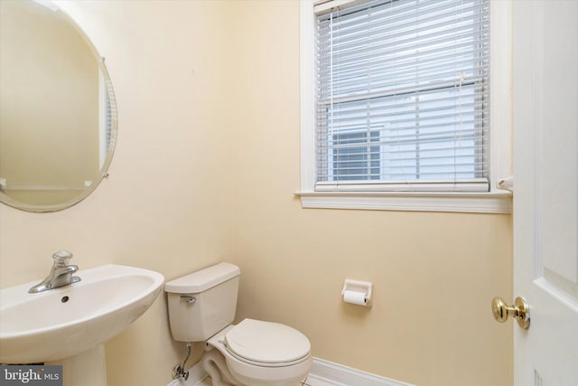 bathroom with toilet and sink