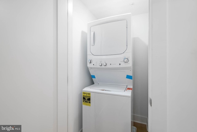 laundry room featuring stacked washing maching and dryer