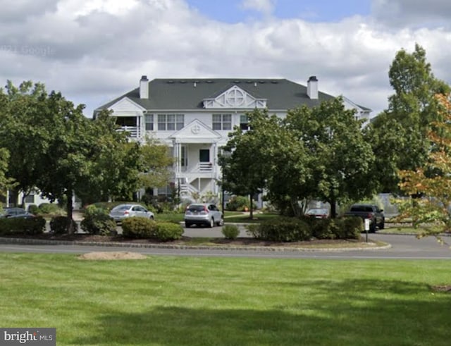 view of property's community with a yard