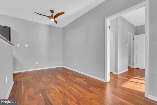 unfurnished room with ceiling fan and wood-type flooring