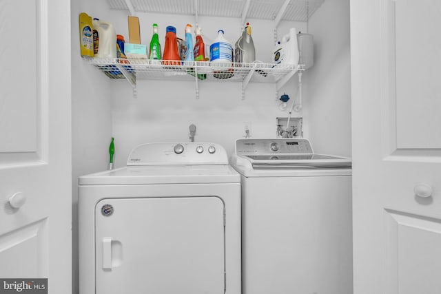 clothes washing area featuring washing machine and dryer