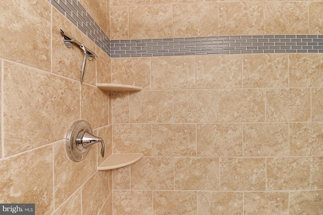 details with a tile shower