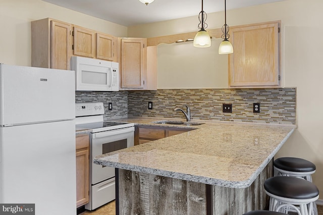 kitchen with white appliances, hanging light fixtures, light brown cabinetry, tasteful backsplash, and sink