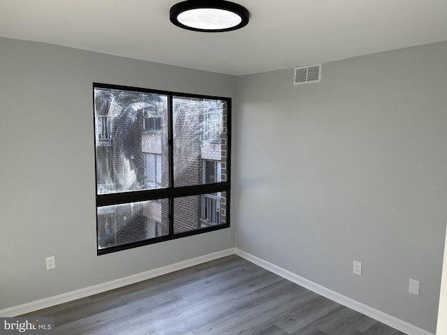 spare room featuring hardwood / wood-style flooring