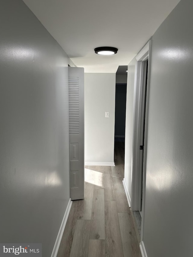 corridor featuring light hardwood / wood-style floors