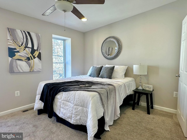 carpeted bedroom with ceiling fan