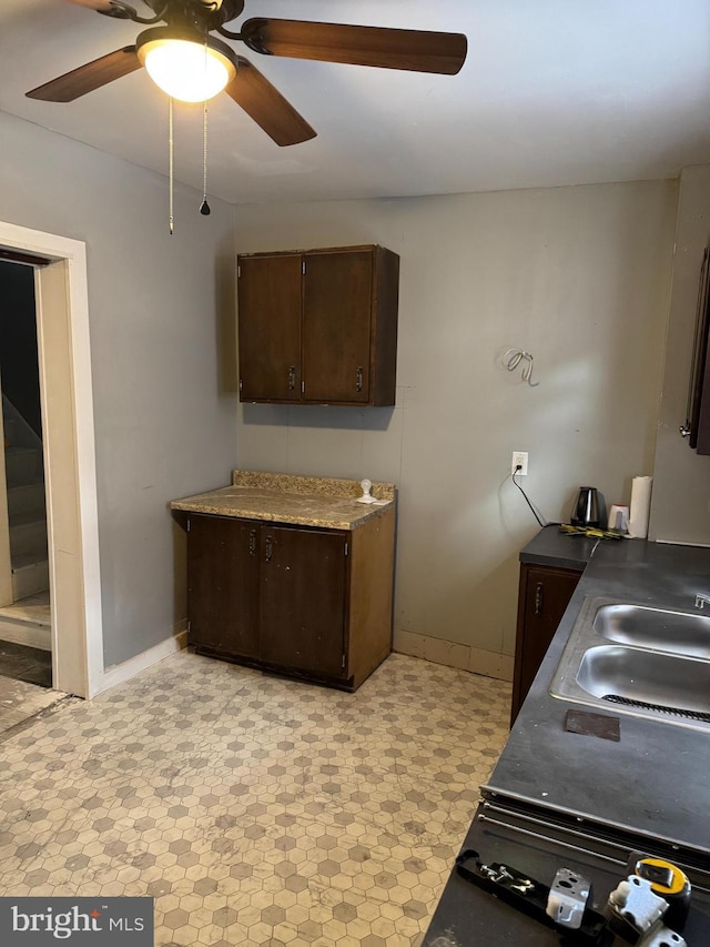 kitchen with sink and dark brown cabinetry