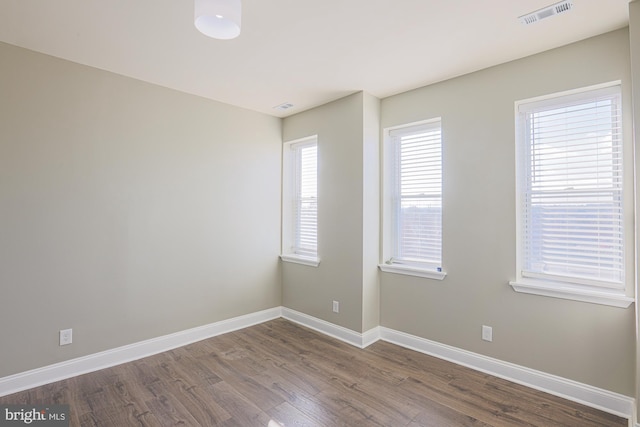 empty room featuring wood-type flooring