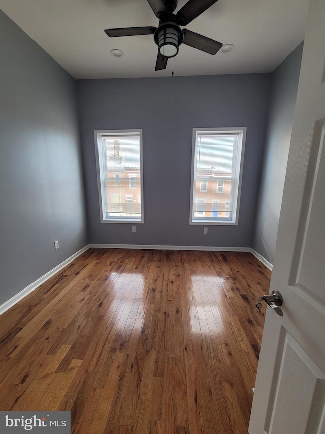 unfurnished room featuring hardwood / wood-style floors