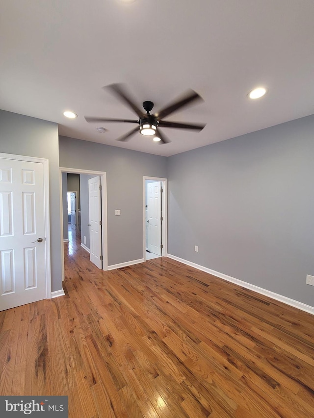 spare room featuring ceiling fan and light wood-type flooring