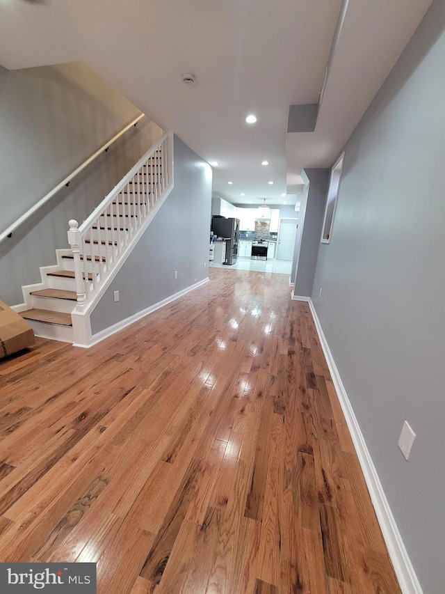 unfurnished living room featuring wood-type flooring