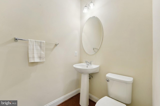 bathroom with toilet and sink