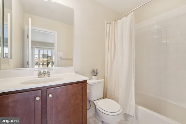 full bathroom with toilet, vanity, and shower / tub combo