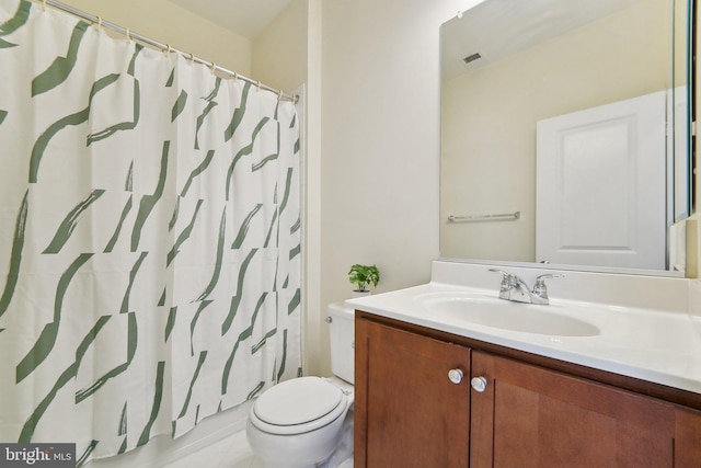 bathroom with toilet, tile patterned floors, walk in shower, and vanity